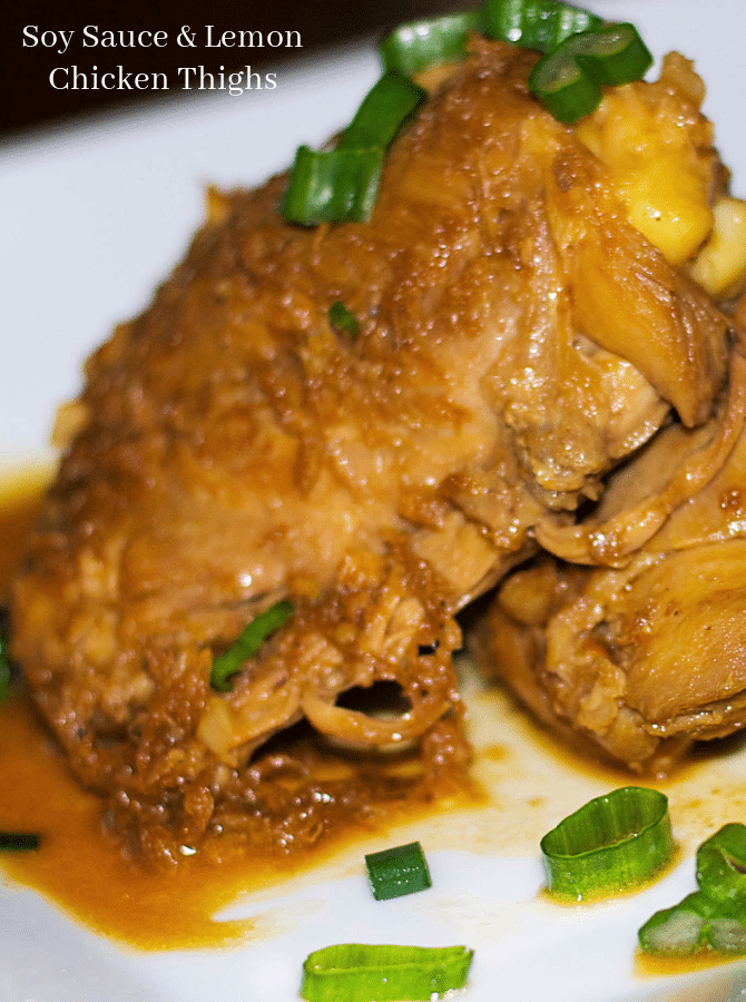 a piece of soy sauce and lemon chicken on a plate
