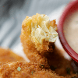 a close up of a fried artichoke heart inside