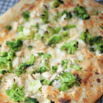 flatbread pizza topped with chicken and broccoli