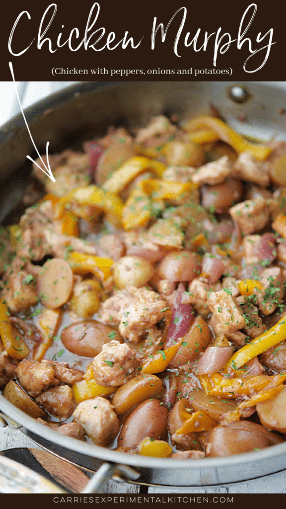 chicken murphy in a skillet with peppers, onions and potatoes