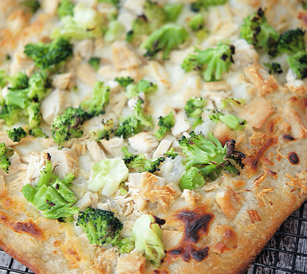 chicken and broccoli flatbread pizza on a wire rack