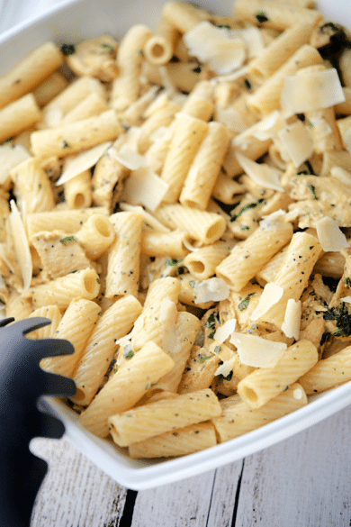 a white pasta bowl filled with lemon pepper rigatoni with grilled chicken
