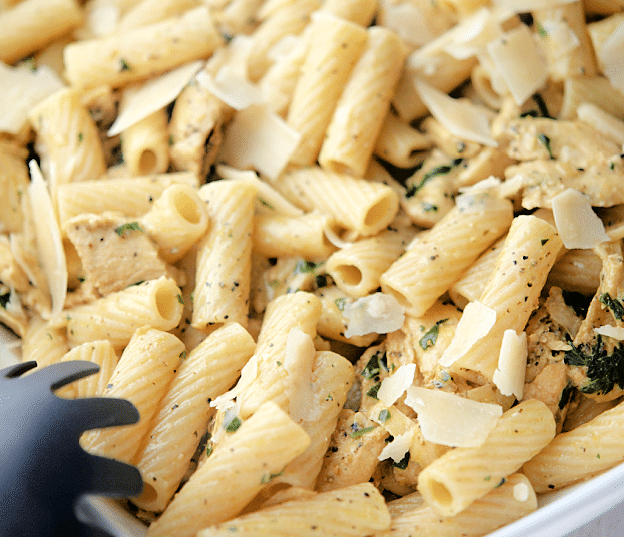 a white pasta bowl filled with lemon pepper rigatoni with grilled chicken