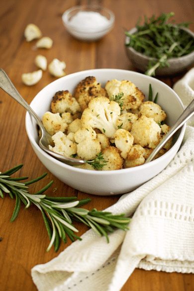 italian roasted cauliflower in a bowl with a spoon