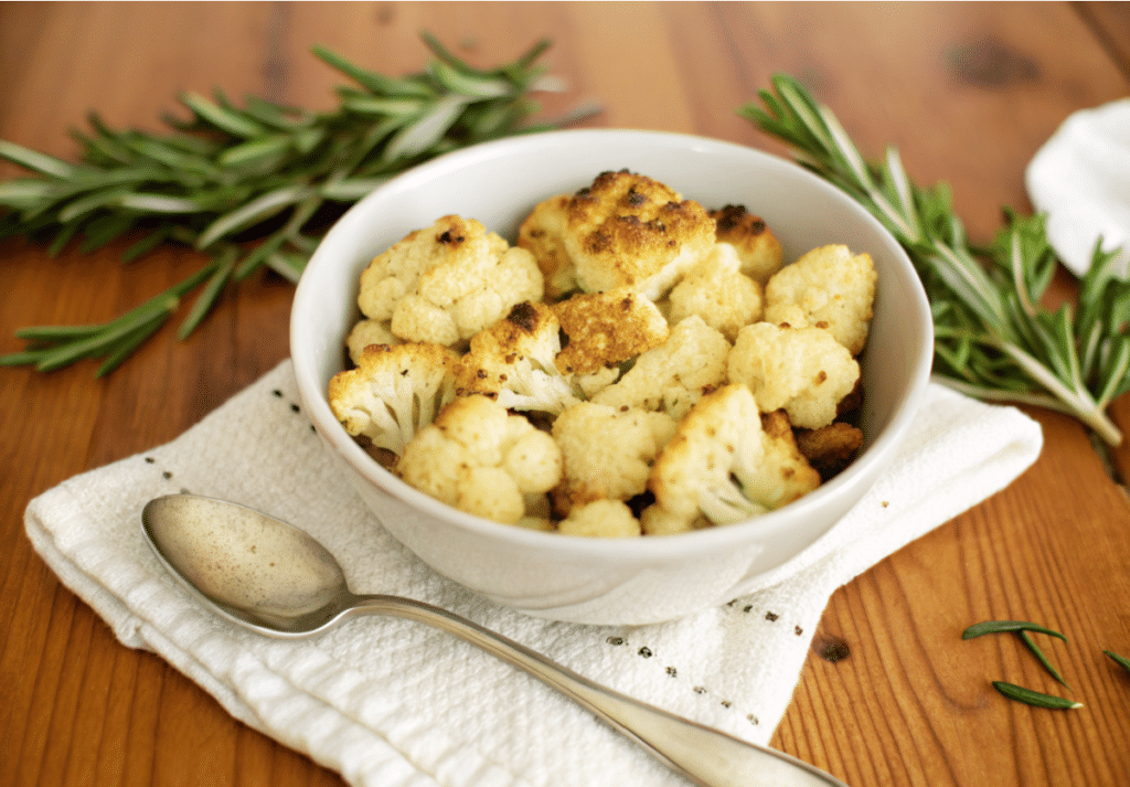 a close up of italian roasted cauliflower in a bowl
