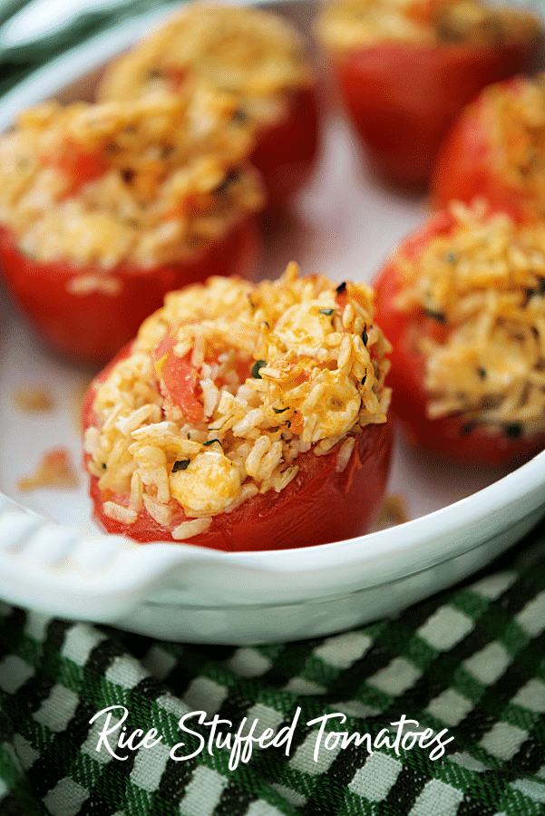 a dish with rice stuffed tomatoes