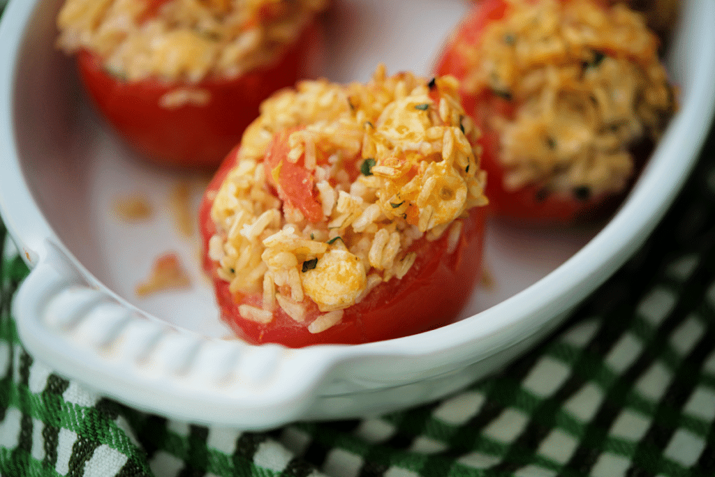 a close up of rice stuffed tomatoes