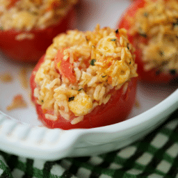 a close up of rice stuffed tomatoes