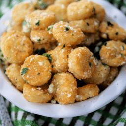 a close up of a dish of tater tots