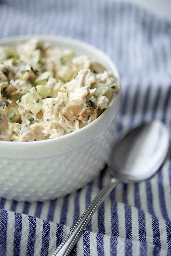 a white bowl with bacon ranch chicken salad