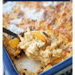 peaches and cream baked oatmeal on a spoon in a white and blue dish