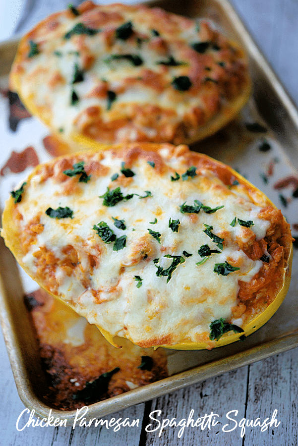 chicken parmesan spaghetti squash in boats with melted cheese