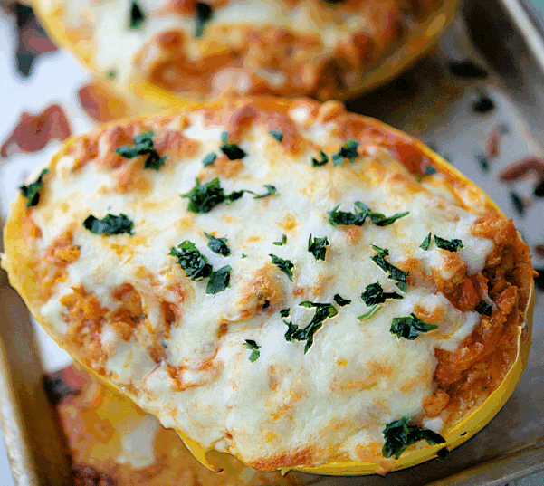 two stuffed chicken parmesan spaghetti squash boats