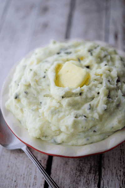 ricotta and basil whipped potatoes in a bowl