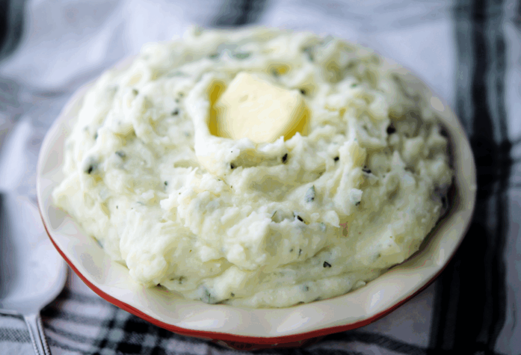 a close up of ricotta mashed potatoes in a bowl