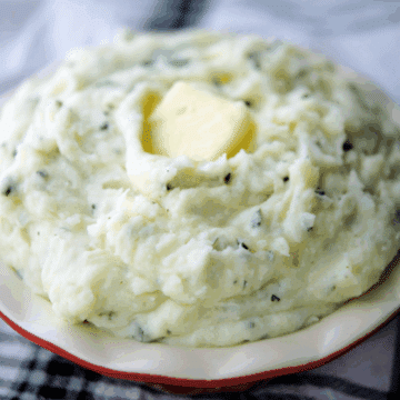 a close up of ricotta mashed potatoes in a bowl