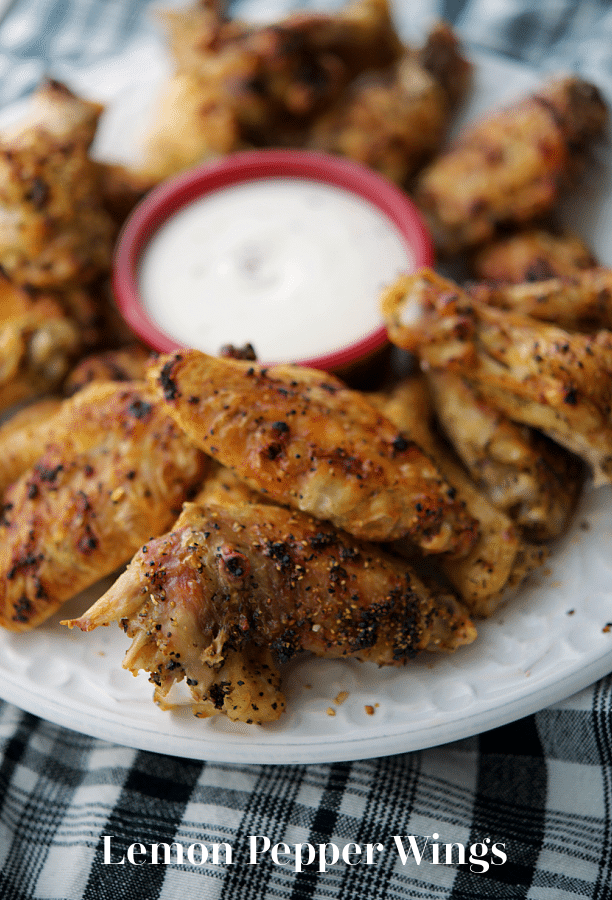 a plate of lemon pepper chicken wings