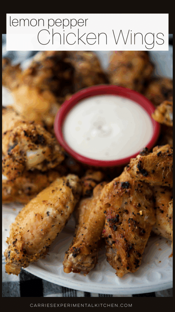 lemon pepper chicken wings in a plate with dip