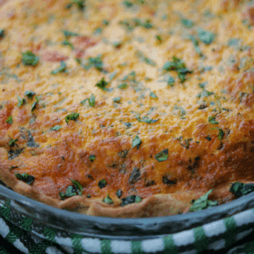 a close up of tomato caprese quiche
